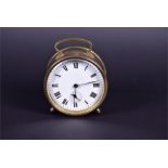 A late Victorian / Edwardian brass cylinder cased alarm clock the white enamelled dial with black