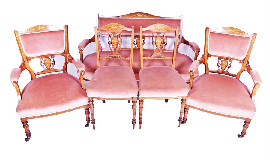 An Edwardian five-piece salon suite comprising a two-seater sofa (137cm wide), a pair of armchairs