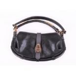 A Burberry Prorsum Black Pony Cadet Sling bag with zipped internal sections, black leather and
