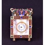 A French gilt brass and enamel miniature boudoir clock of square form, with horseshoe and scroll