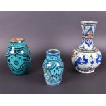 A Middle Eastern bottle vase decorated in the Iznik palette of tall-necked form with bulbous body,