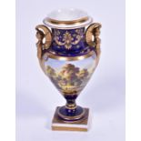 An early 19th century Derby porcelain vase of baluster form with twin figural handles, the body with