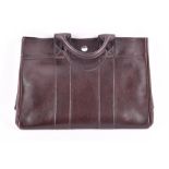 A Hermes Paris small dark brown leather tote bag with loop handles and zipped internal pocket,
