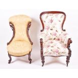 A Victorian mahogany armchair  with later upholstery, the scroll end arms on turned support, 63 cm