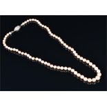 A single strand of cultured pearls the graduated pearls from 4.5 - 7.4 mm, with a white metal