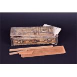 A 19th century carved and painted prisoner of war box decorated with naively painted houses, with