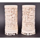 A pair of early 19th century Chinese ivory Cantonese region brush pots both having intricate deep