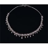 A white metal and diamond necklace (unmarked), the articulated mount set with thirty trillion-cut,