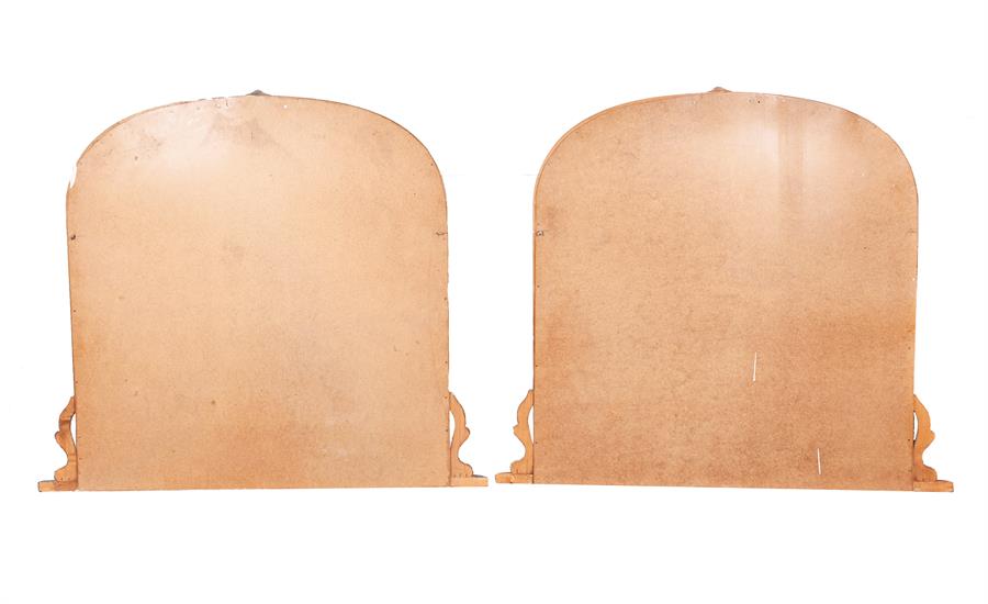 A pair of 20th century wooden overmantle mirrors (one painted), of arched form with stylised - Image 2 of 2