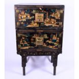 A 20th century black lacquer double cabinet on stand of rectangular form, the stacking sections