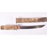 An early 20th century carved bonework cased Japanese tanto / katana  the grip and scabbard heavily