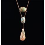 A yellow metal and turquoise drop pendant necklace with pear-shaped green hardstone pendant