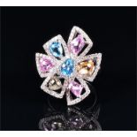 An 18ct white gold, diamond, and multi-coloured topaz ring of geometric floral form, the openwork