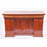 A 19th century mahogany sideboard and later top with three slides over central two-door cupboard