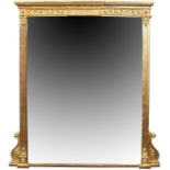 A large 19th century gilded wall mirror  the original antique bevelled glass plate with ageing in