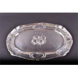 An Edwardian silver tray Birmingham, 1902 by Henry Matthews, decorated with cherubs, 12 ozt. total.