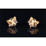 A pair of yellow metal leopard earrings each in the form of a leopard face, with ruby eyes and