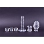 A small collection of Waterford crystal to include a lidded egg shaped jar, 15 cm high, three