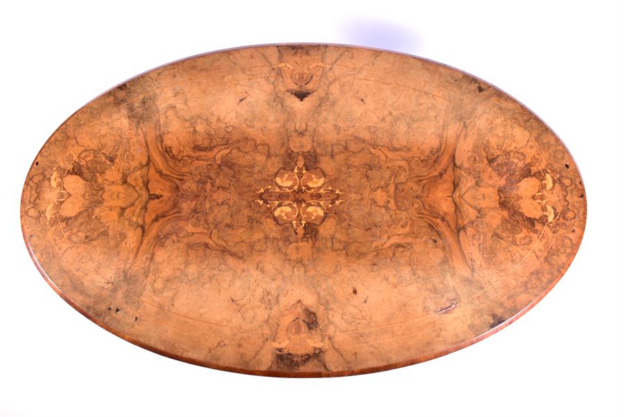 A Victorian figured walnut oval stretcher table the top with floral inlay and angled rim, - Image 4 of 6