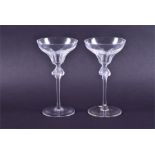 A pair of contemporary Lalique crystal cocktail glasses the slice cut bowls above frosted stems