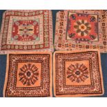 A collection of four Persian carpet cushion covers two sized 50 cm x 50 cm & two sized 40 cm x 40 cm