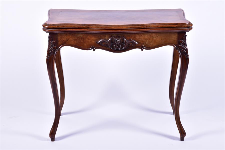 A late 19th century French walnut folding card table the serpentine top opening to reveal a baize - Image 3 of 7