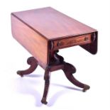 A 19th century mahogany Pembroke table the cross-banded top with a pair of folding flaps over a