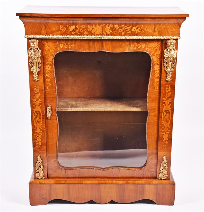 A Victorian walnut and ormolu mounted pier cabinet with inlaid decoration of floral sprays, the