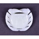 A Chinese white jade carved crab pendant the stone in a pronounced white tone, 19th/20th century,