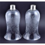 A pair of Baccarat glass storm lamp shades of flared rim form, each with acid etched scrolled