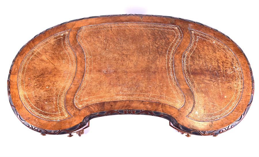 A Victorian figured walnut kidney shaped writing desk with inset leather top over two small - Image 4 of 6