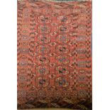 A Bokhara Pakistan part silk rug  with repeating geometric lozenges on a deep red ground, 130 cm x