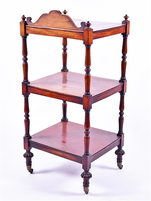 A Victorian mahogany three tier whatnot with carved frieze and turned supports to brass castors. - Image 4 of 4