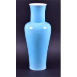 A contemporary Chinese porcelain vase of tapering baluster form with drawn neck and flared rim,