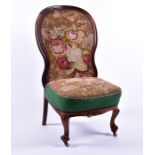 A Victorian mahogany tapestry upholstered chair on front scroll feet, 56 cm wide.