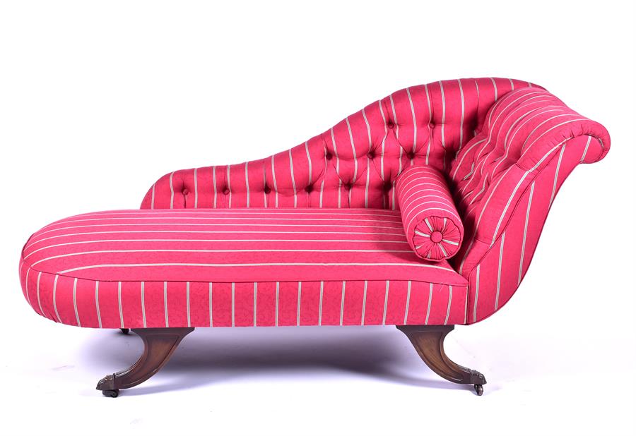 A reproduction button back Chaise longue with red upholstery, on four outswept supports