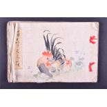 A Japanese meiji period erotic book containing ten woodblock prints of couples and groups, with some