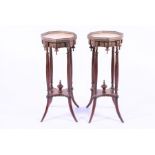 A pair of 19th century French Empire style jardinière stands the octagonal marble tops with brass