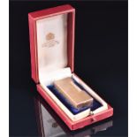 A Dunhill 9ct yellow gold lighter of rectangular form with textured finish, 6.3 x 2.3 x 1.3 cm, in