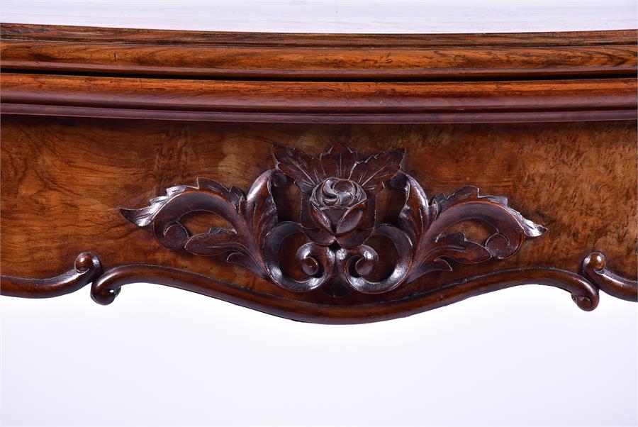 A late 19th century French walnut folding card table the serpentine top opening to reveal a baize - Image 4 of 7