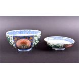 A Japanese Meiji period Famille Verte bowl and cover with alternating decorative panels depicting