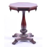 A Victorian rosewood octagonal centre table the figured top with moulded rim, supported on an