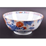 An 18th century Chinese Kangxi / Yonghzeng period bowl with blue and iron-red decoration depicting