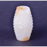 A Chinese white jade pendant of barrel form 20th century, 4.5 cm wide.