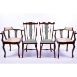 A pair of Edwardian mahogany corner chairs  with splat frame supports and upholstered seats,