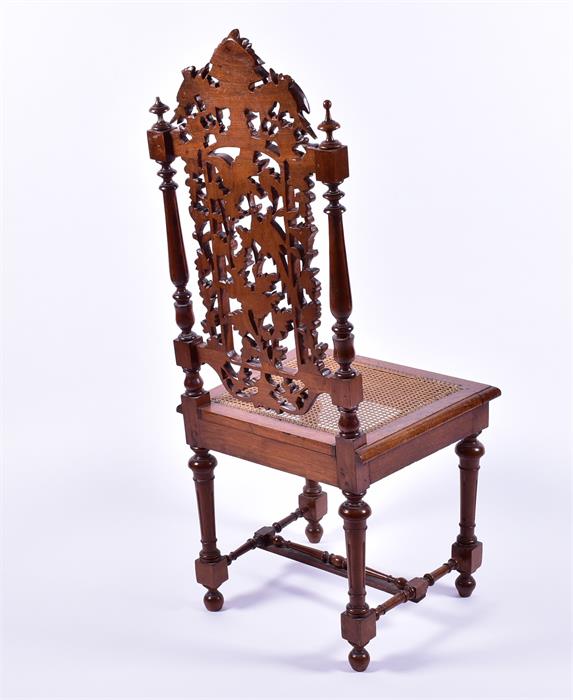 An early 20th century oak side chair with detailed armorial carving over pierced acorn, leaf and - Image 2 of 6