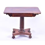 A Regency rosewood side table with fixed converted flaps, supported on a wrythen column, to a