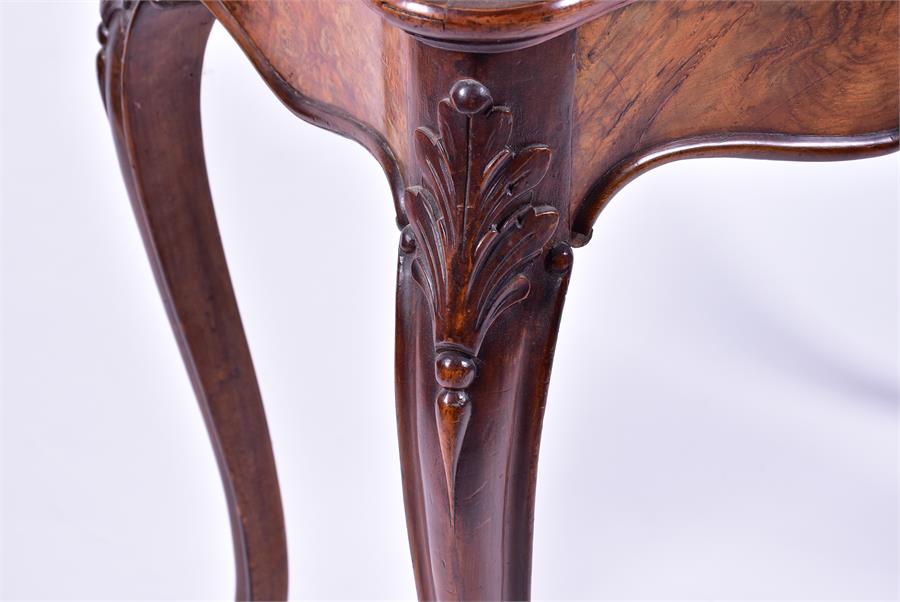 A late 19th century French walnut folding card table the serpentine top opening to reveal a baize - Image 5 of 7