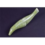 A carved Inuit green soapstone seal 28 cm long. CONDITION REPORT Good general order, with some