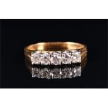 An 18ct yellow gold and diamond ring set with five round brilliant-cut diamonds of approximately 0.